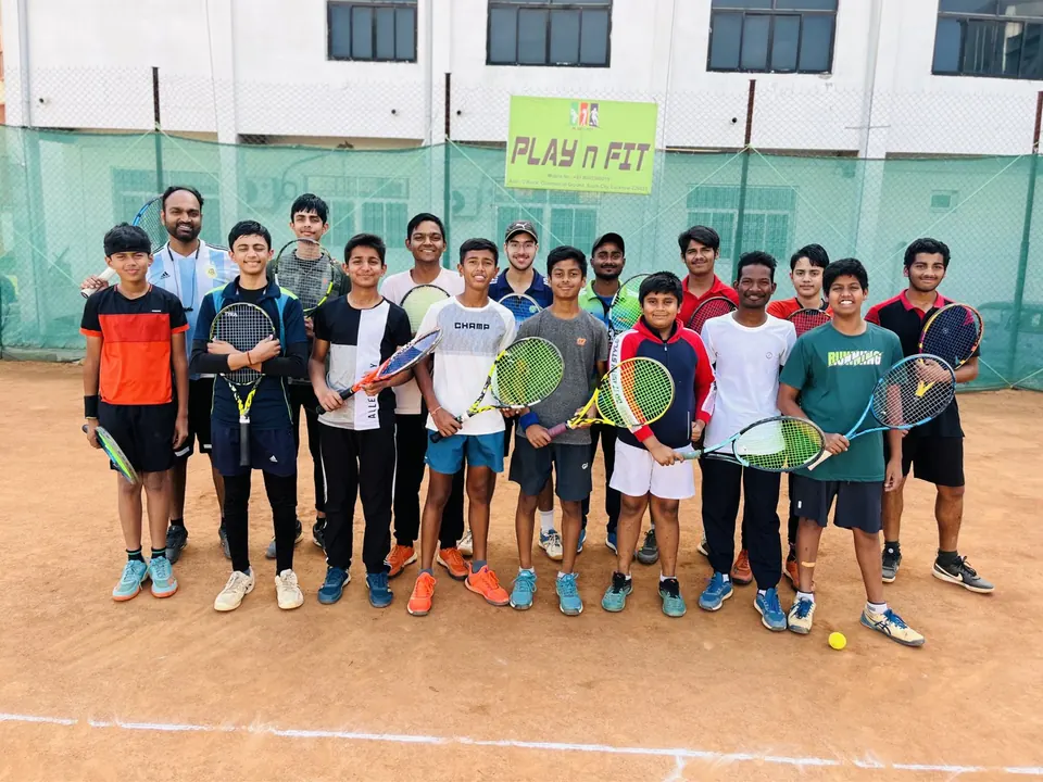 PLAY n FIT players holding racquets on court